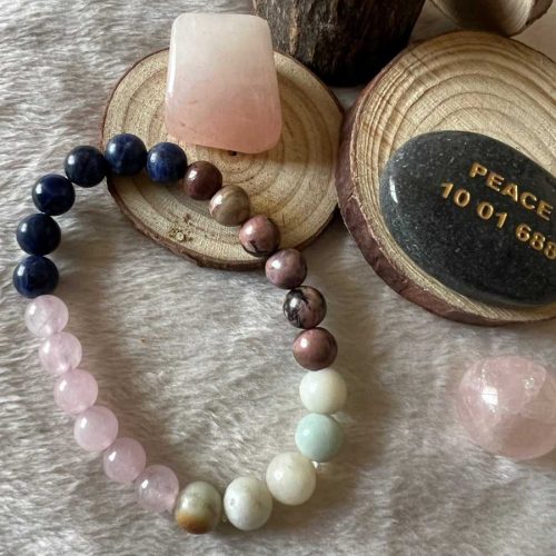 This Meraki Happy Married Life Bracelet features Rose Quartz, Amazonite, Sodalite, and Rhodonite to promote love, communication, and emotional healing within a marriage. A thoughtful gift for couples.