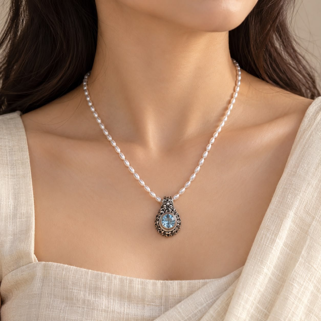 Blue topaz pearl carved pendant